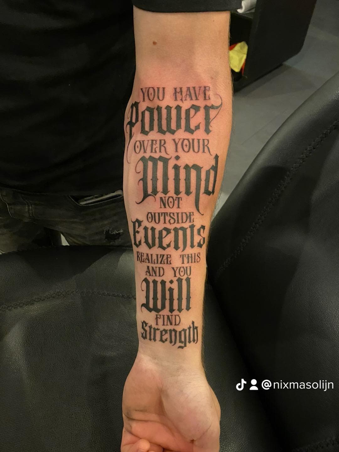 Blackletter lettering tattoo onderarm — you have power over your mind not outside events